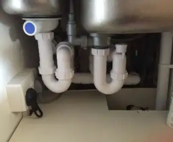 Kitchen sink plumbing re-installed to correct requirements